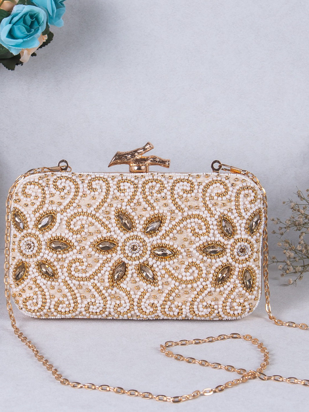 Golden small pearl clutch