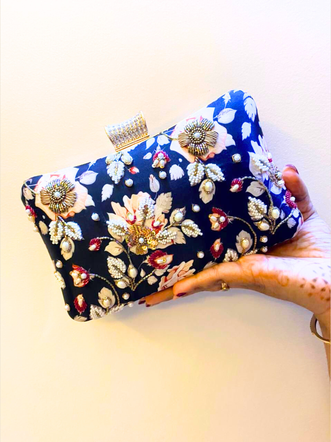 Embroidered blue clutch bag